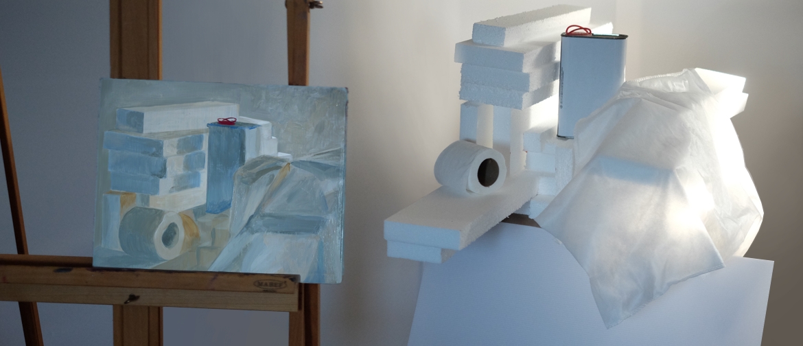 Monochromatic still life of white objects, in the studio beside its setup.